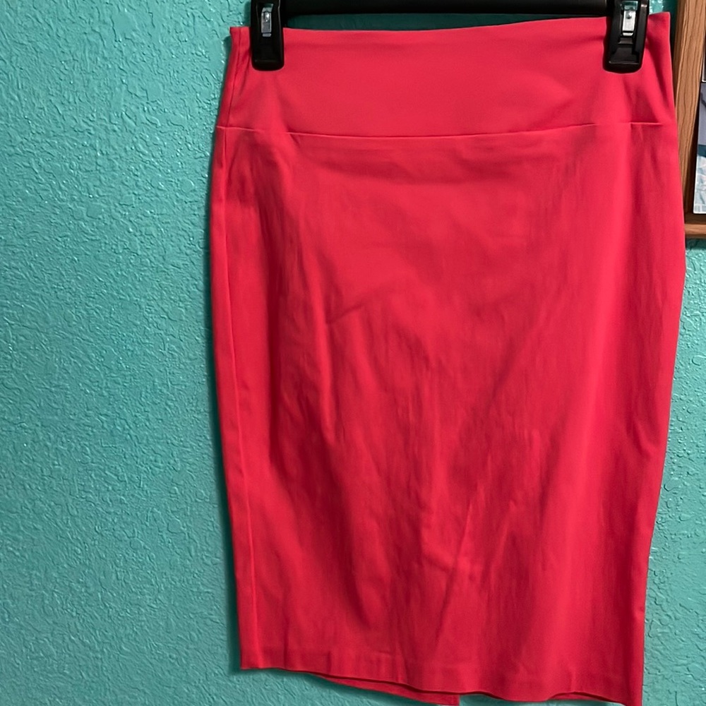 Light pink, mini skirt. Never worn.